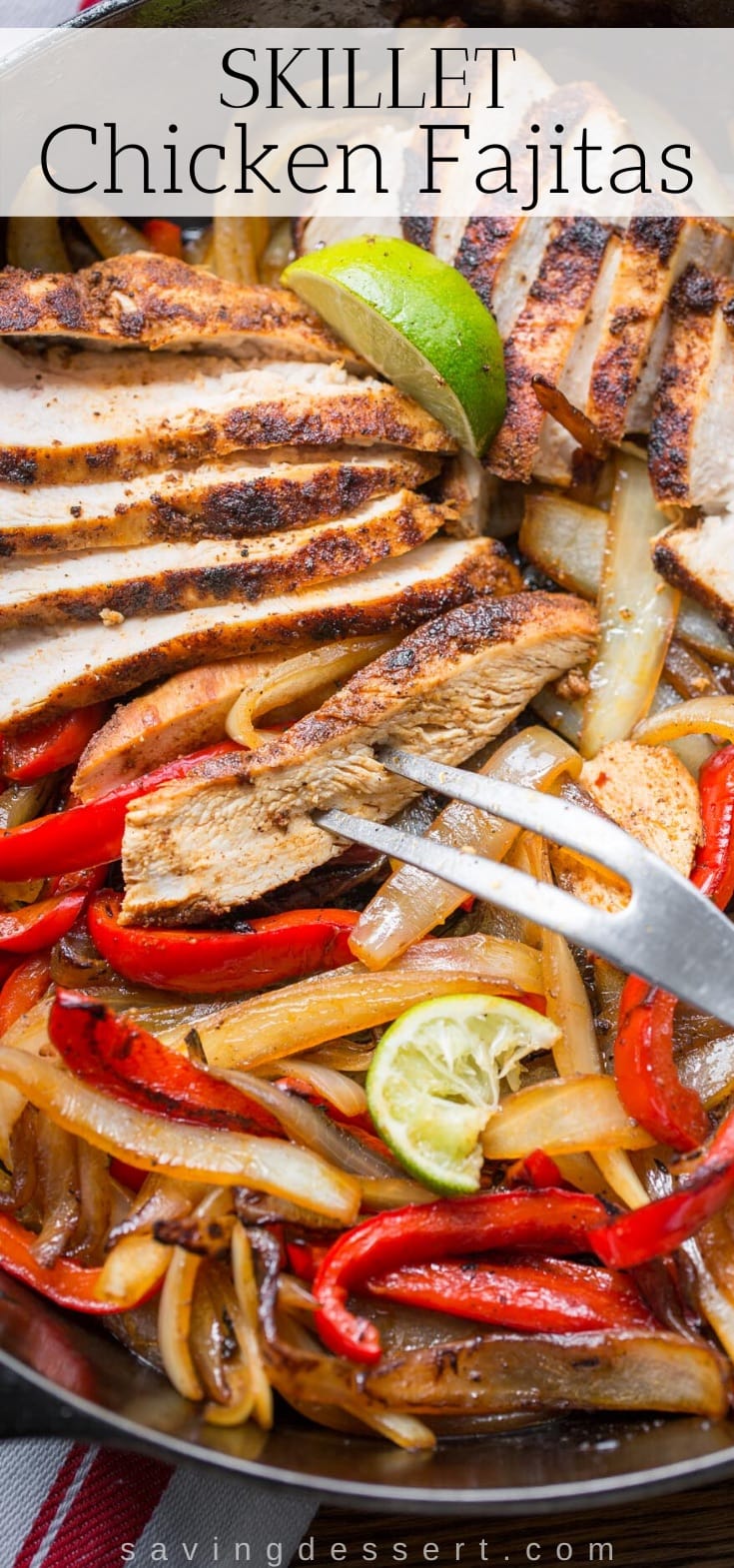 A skillet loaded with sliced chicken fajitas with onions and peppers