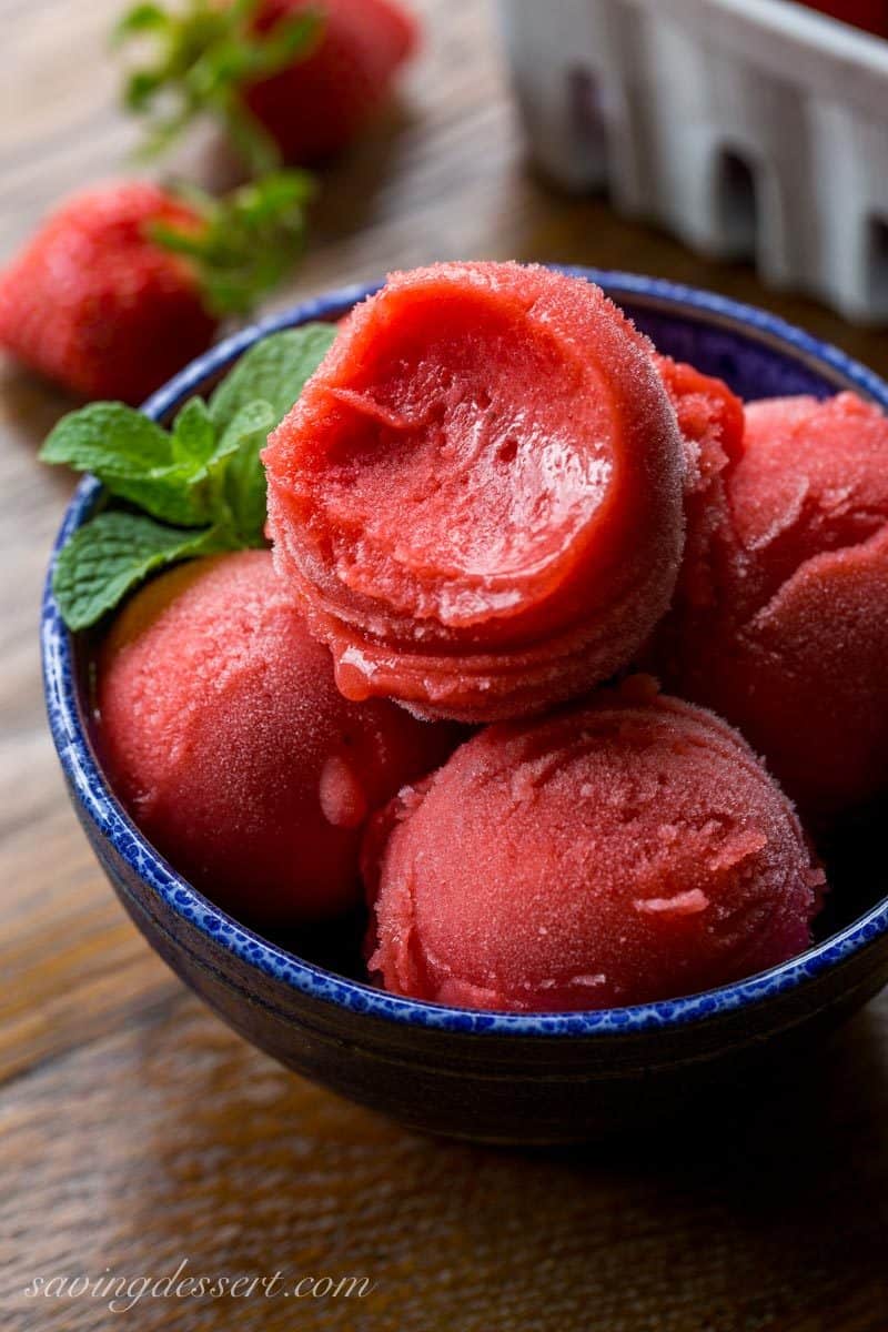 Strawberry Sorbet ~ a simple, easy and delicious sorbet made with only 3 ingredients right in your blender! The intense strawberry flavor is balanced by a few splashes of Grand Marnier which also helps create the incredible texture. www.savingdessert.com