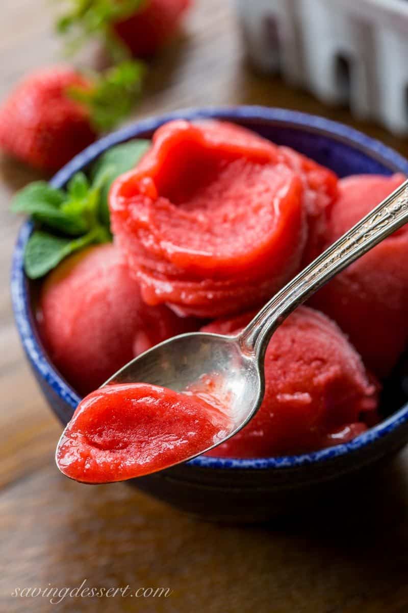 Strawberry Sorbet ~ a simple, easy and delicious sorbet made with only 3 ingredients right in your blender! The intense strawberry flavor is balanced by a few splashes of Grand Marnier which also helps create the incredible texture. www.savingdessert.com