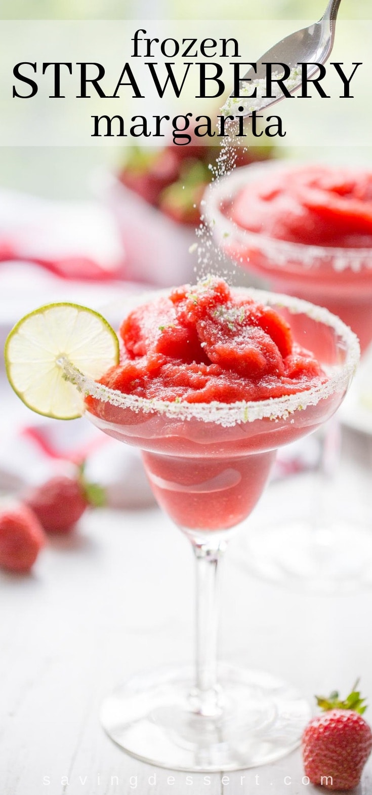 A frozen strawberry margarita sprinkled with lime sugar