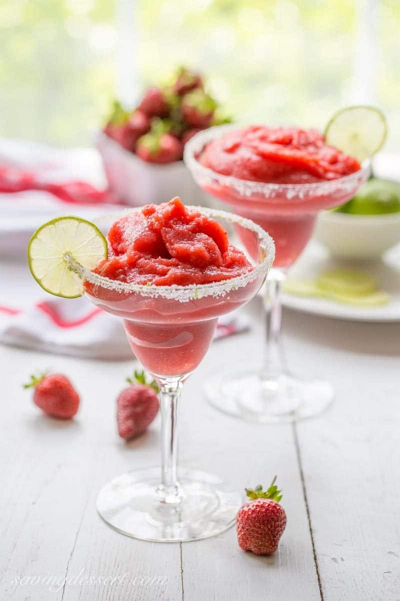 Frozen Strawberry Margarita ~ a delicious cross between a sorbet and a Margarita, and it's almost good enough to be called a dessert! www.savingdessert.com