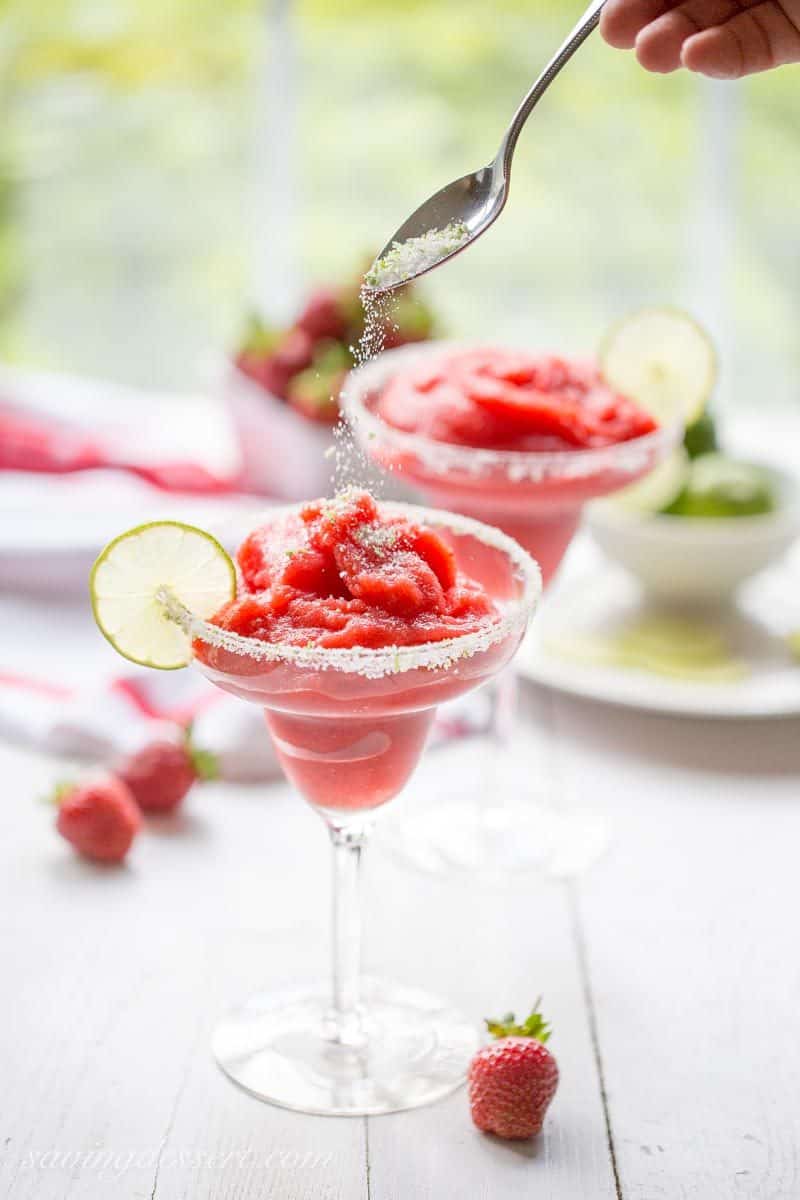 Frozen Strawberry Margarita ~ a delicious cross between a sorbet and a Margarita, and it's almost good enough to be called a dessert! www.savingdessert.com