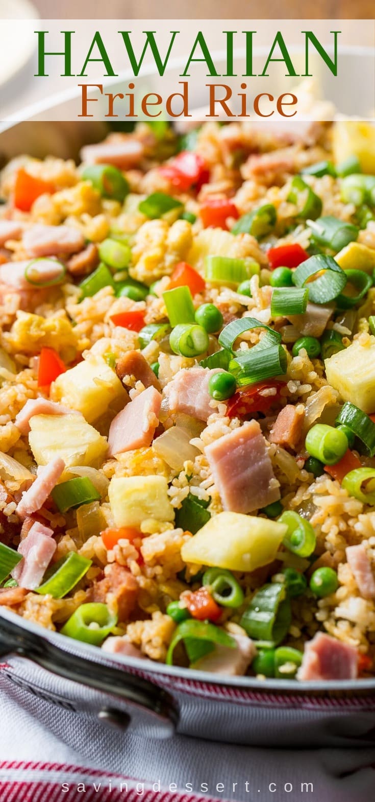 A skillet filled with Hawaiian style fried rice with ham and pineapple