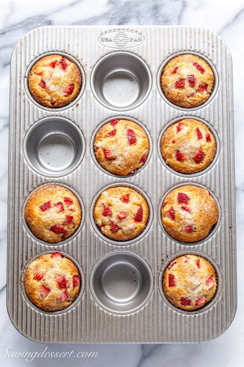 Fresh from the oven strawberry muffins in a muffin tin