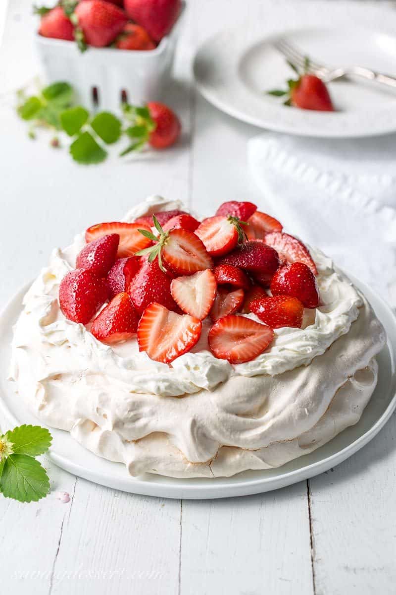 Strawberry & Mascarpone Pavlova Recipe ~ the outside is crisp and sweet with a soft marshmallow-like center. Traditionally served with whipped cream and fresh fruit, the Pavlova is a popular dessert in Australia and New Zealand. www.savingdessert.com