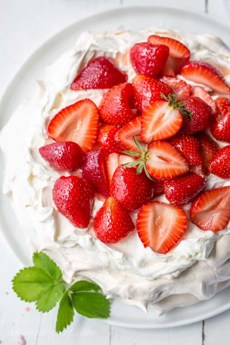 Strawberry & Mascarpone Pavlova Recipe ~ the outside is crisp and sweet with a soft marshmallow-like center. Traditionally served with whipped cream and fresh fruit, the Pavlova is a popular dessert in Australia and New Zealand. www.savingdessert.com