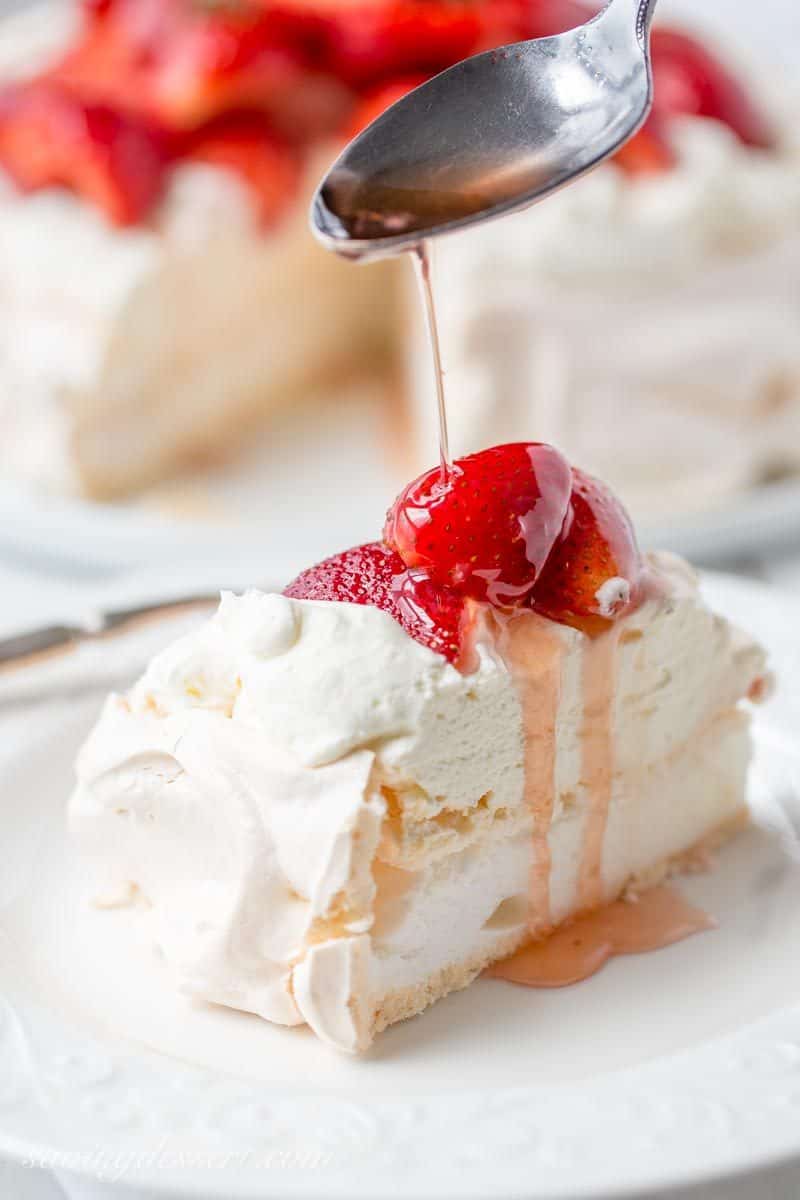Strawberry & Mascarpone Pavlova Recipe ~ the outside is crisp and sweet with a soft marshmallow-like center. Traditionally served with whipped cream and fresh fruit, the Pavlova is a popular dessert in Australia and New Zealand. www.savingdessert.com