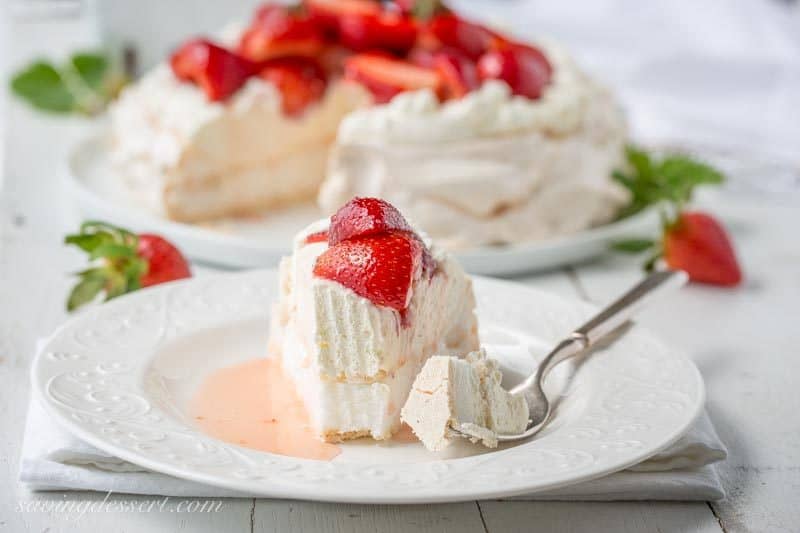 Strawberry & Mascarpone Pavlova Recipe ~ the outside is crisp and sweet with a soft marshmallow-like center. Traditionally served with whipped cream and fresh fruit, the Pavlova is a popular dessert in Australia and New Zealand. www.savingdessert.com