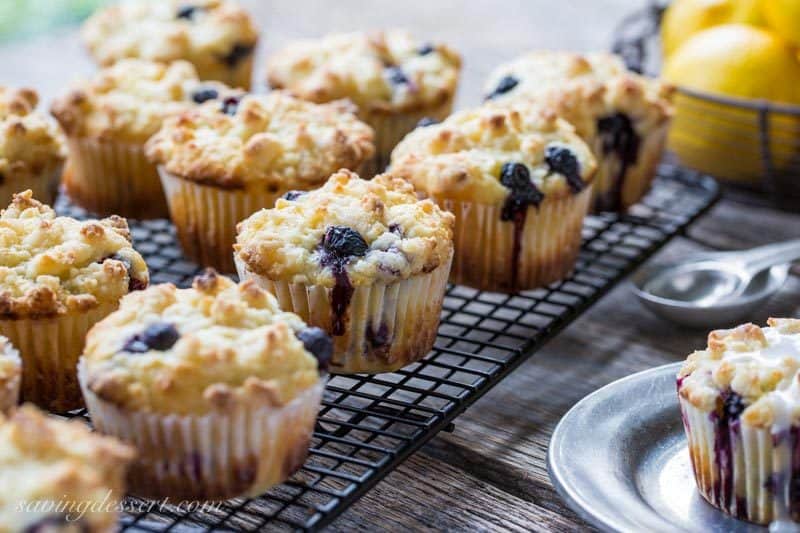 Lemon Blueberry Muffins with a Lemon Crumble Topping ~ Plump, ripe blueberries and tart lemon juice are the stars in these wonderfully moist, sour cream muffins. Not overly sweet, these muffins are terrific with or without the bright lemon glaze. www.savingdessert.com