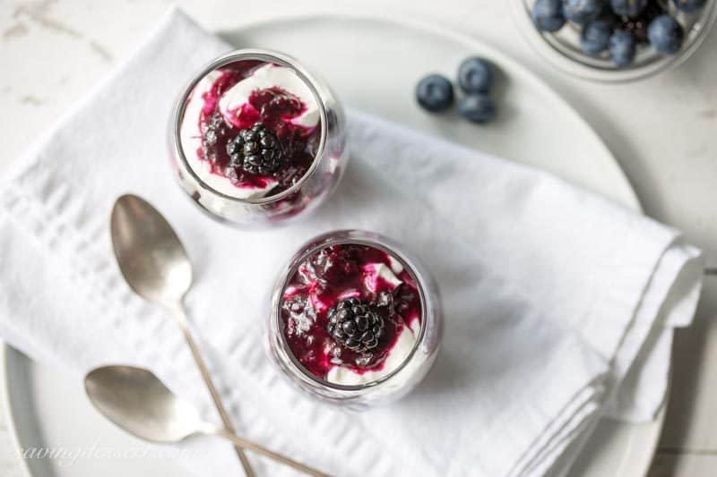 Warm Black & Blueberry Sauce ~ a simple fruit sauce made with blackberries and blueberries with a tangy bite from the fresh lemon juice.  With just a little sugar, this versatile sauce is great on just about everything! www.savingdessert.com