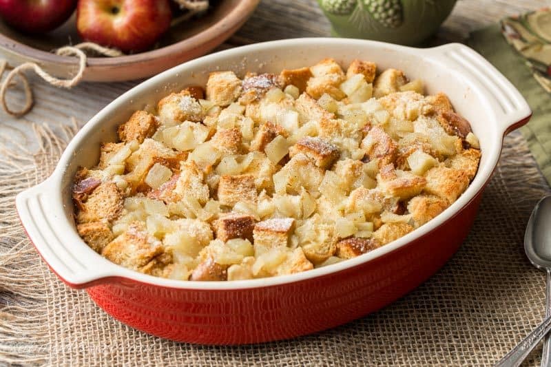 A casserole dish filled with apple bread pudding