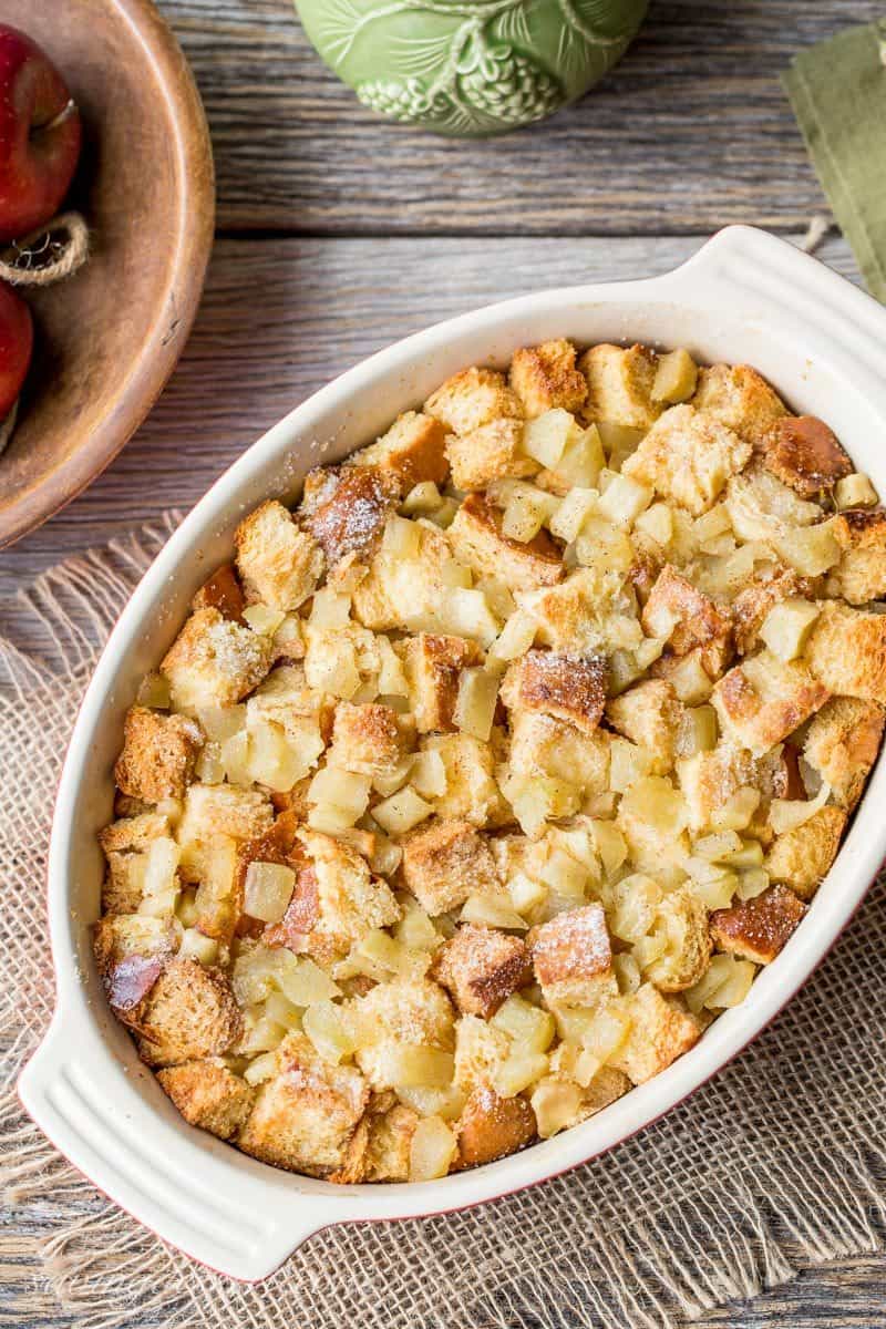 An overhead view of a casserole filled with bread pudding with apples