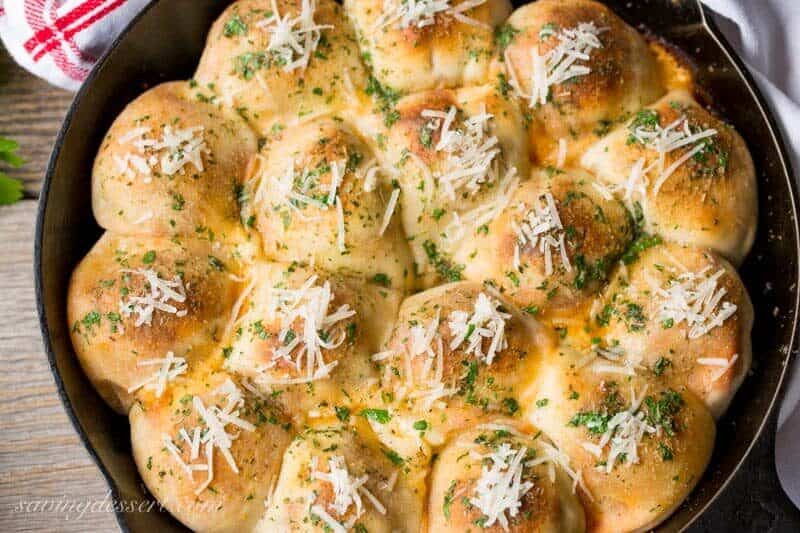 An overhead view of a skillet filled with mini meatball calzones