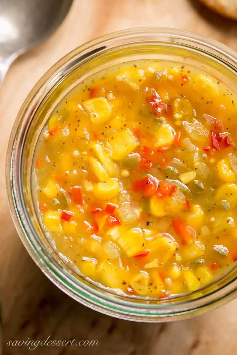 Spicy Corn Relish - a sweet and spicy corn relish terrific served on hot dogs, hamburgers, nachos, sandwiches or even a cracker. This relish is also the perfect tangy topping for grilled meats and fish too! www.savingdessert.com