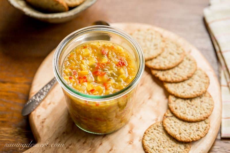 Spicy Corn Relish - a sweet and spicy corn relish terrific served on hot dogs, hamburgers, nachos, sandwiches or even a cracker. This relish is also the perfect tangy topping for grilled meats and fish too! www.savingdessert.com