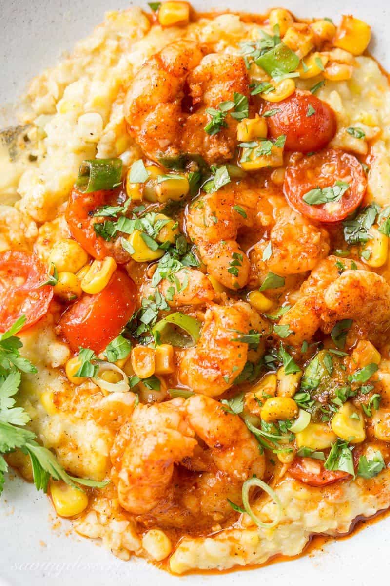 Spicy Shrimp &amp;amp; Fried Corn ~ A fresh and tasty twist on classic shrimp and grits! Creamy, sweet fried corn is topped with spicy shrimp, garden fresh tomatoes and green onions for a delicious bowl of healthy comfort food! www.savingdessert.com