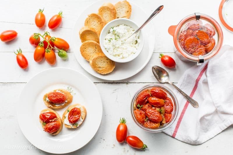 Sweet summer tomatoes are slow cooked in the oven with olive oil, garlic, crushed red pepper and a handful of fresh thyme.  www.savingdessert.com