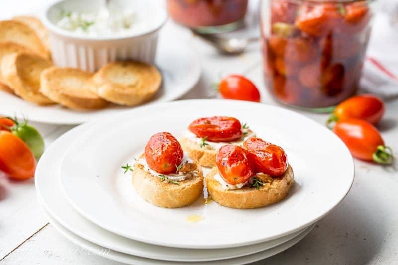 Sweet summer tomatoes are slow cooked in the oven with olive oil, garlic, crushed red pepper and a handful of fresh thyme.  www.savingdessert.com