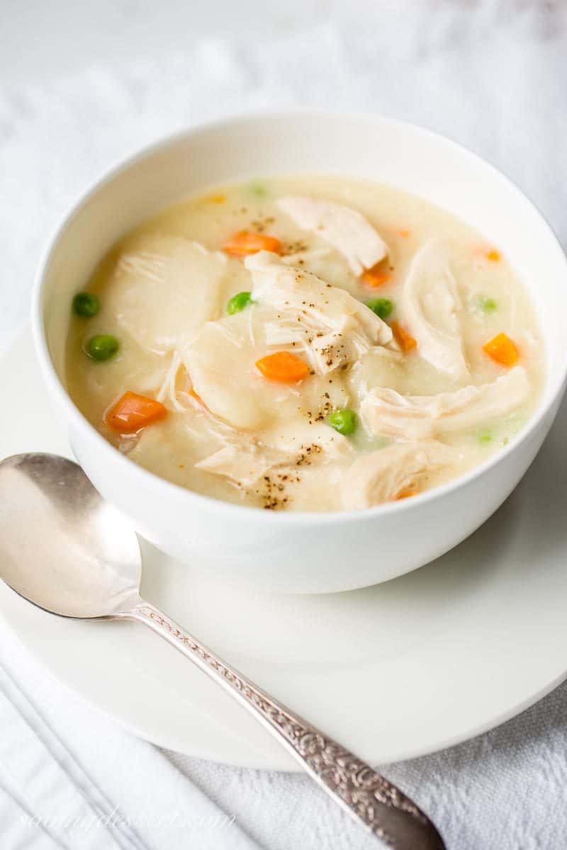 Homemade Chicken and Dumplings ~ a deliciously rich homemade chicken stock is used for the base of this warming, healing pot of pure southern comfort food. www.savingdessert.com #savingroomfordessert #chickenbroth #chickenstock #chickenanddumplings #dumplings #dinner #chicken