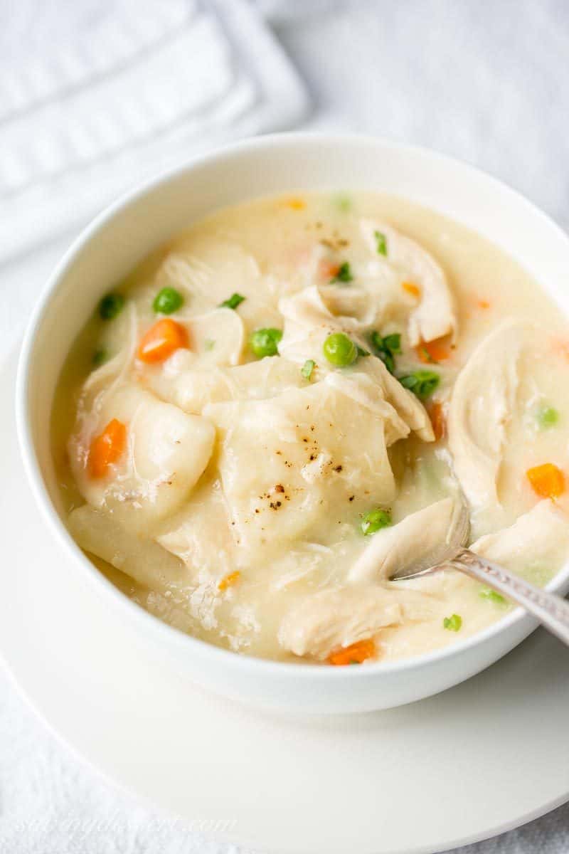 Homemade Chicken and Dumplings ~ a deliciously rich homemade chicken stock is used for the base of this warming, healing pot of pure southern comfort food. www.savingdessert.com #savingroomfordessert #chickenbroth #chickenstock #chickenanddumplings #dumplings #dinner #chicken