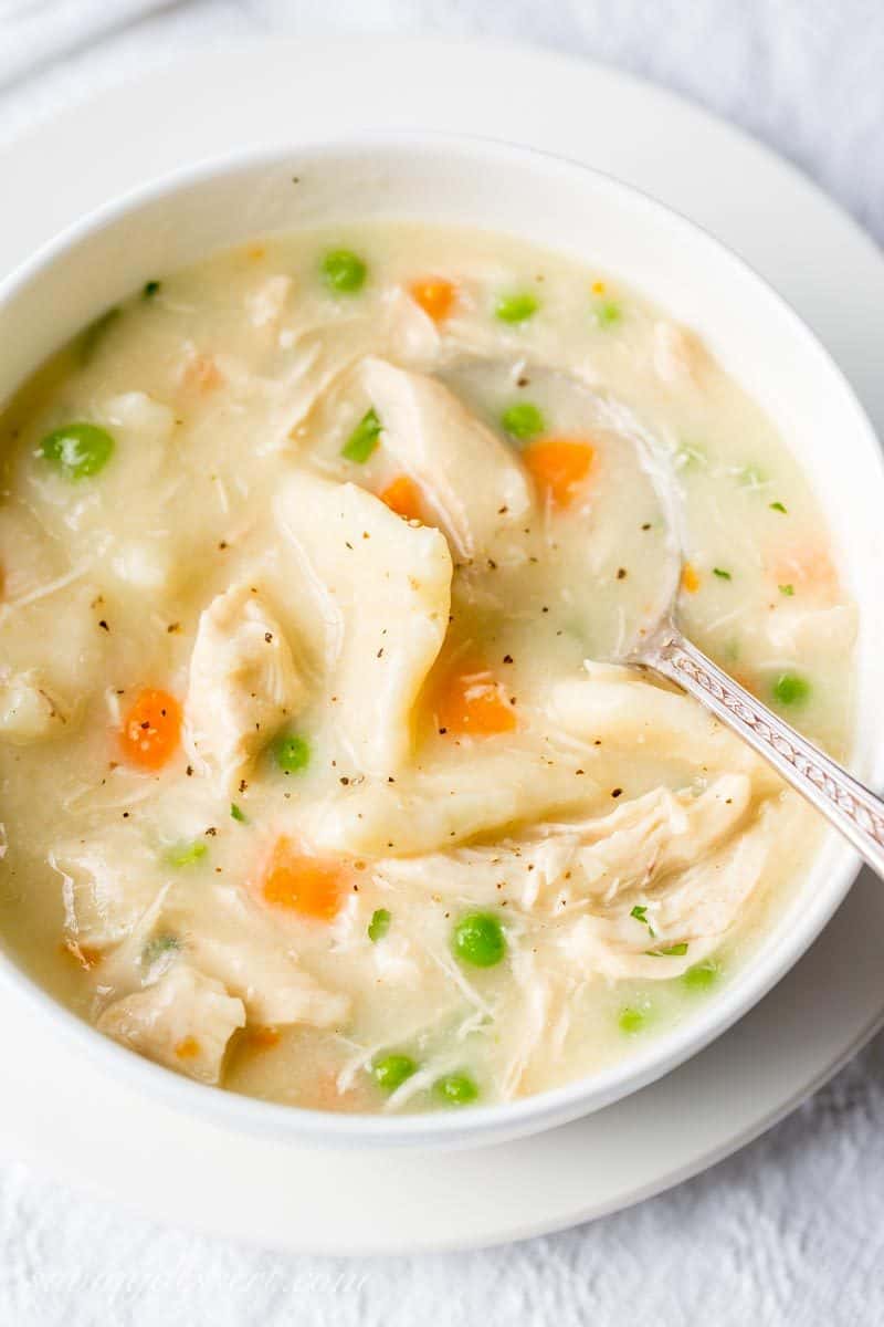 Homemade Chicken and Dumplings ~ a deliciously rich homemade chicken stock is used for the base of this warming, healing pot of pure southern comfort food. www.savingdessert.com #savingroomfordessert #chickenbroth #chickenstock #chickenanddumplings #dumplings #dinner #chicken