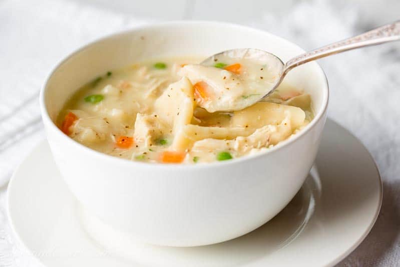 Homemade Chicken and Dumplings ~ a deliciously rich homemade chicken stock is used for the base of this warming, healing pot of pure southern comfort food. www.savingdessert.com #savingroomfordessert #chickenbroth #chickenstock #chickenanddumplings #dumplings #dinner #chicken
