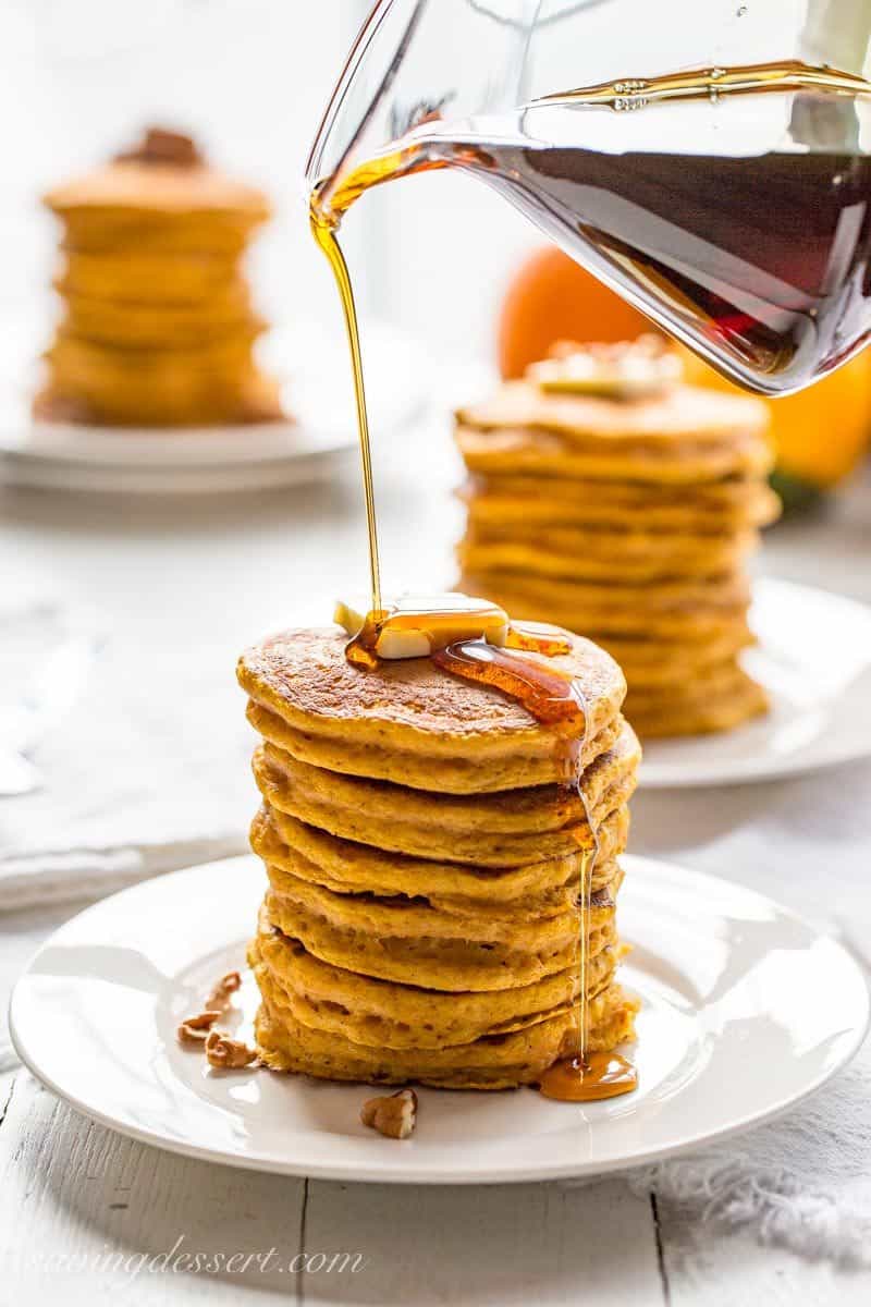 The Best Pumpkin Pancakes - thick, light and super fluffy, our Pumpkin Pancakes are well spiced, lightly sweet and easy to make too! savingdessert.com #pumpkin #pancakes #pumpkinpiespice