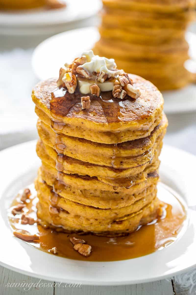 The Best Pumpkin Pancakes - thick, light and super fluffy, our Pumpkin Pancakes are well spiced, lightly sweet and easy to make too! savingdessert.com #pumpkin #pancakes #pumpkinpiespice #pumpkinpancakes