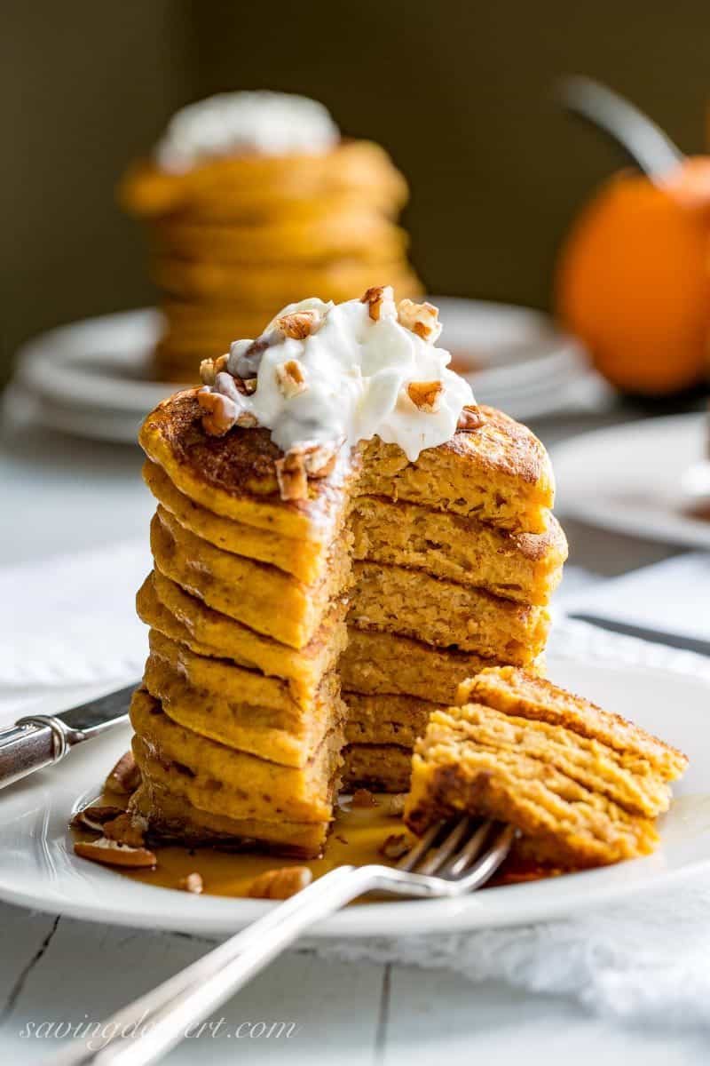The Best Pumpkin Pancakes - thick, light and super fluffy, our Pumpkin Pancakes are well spiced, lightly sweet and easy to make too! savingdessert.com #pumpkin #pancakes #pumpkinpiespice #pumpkinpancakes