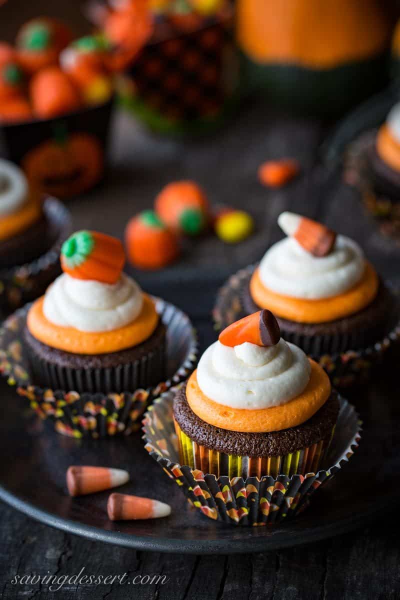 Easy Chocolate Cupcakes Recipe with Fluffy Vanilla Buttercream Frosting ~  classic chocolate cupcakes that are tender and moist, and don't fall apart when you take a big bite. Topped with fluffy, melt in your mouth buttercream frosting with just a little bit of cream cheese added for stability and creaminess.  Not just for Halloween! savingdessert.com #savingroomfordessert #cupcakes #halloween #chocolatecupcakes #chocolatecake #cake #mayonnaisecake #dessert