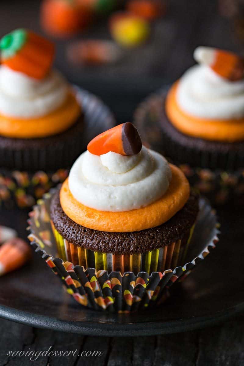 Easy Chocolate Cupcakes Recipe with Fluffy Vanilla Buttercream Frosting ~  classic chocolate cupcakes that are tender and moist, and don't fall apart when you take a big bite. Topped with fluffy, melt in your mouth buttercream frosting with just a little bit of cream cheese added for stability and creaminess.  Not just for Halloween! savingdessert.com #savingroomfordessert #cupcakes #halloween #chocolatecupcakes #chocolatecake #cake #mayonnaisecake #dessert