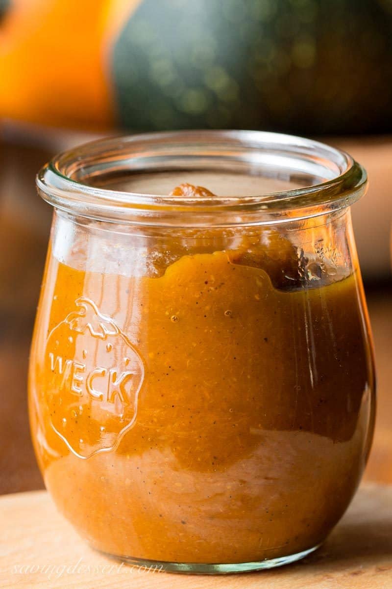 A close up photo of a jar of maple pumpkin butter