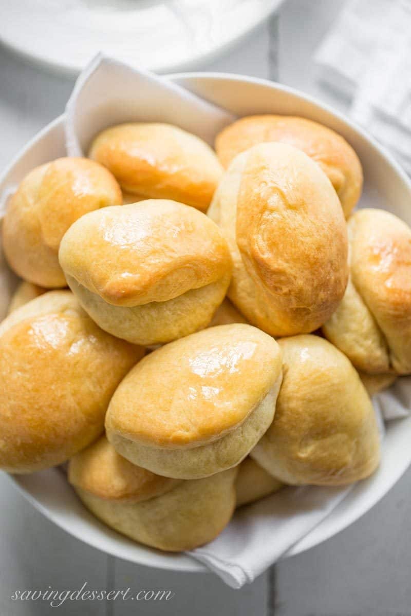 Homemade Parker House Rolls ~ Puffy, pillowy soft and buttery, homemade Parker House Rolls are easy to make and even easier to eat! www.savingdessert.com #savingroomfordessert #parkerhouserolls #homemaderolls #yeastrolls #rolls #dinnerrolls