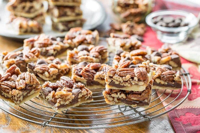 Chocolate Pecan Pie Bars with Bourbon & Sea Salt ~ a delicious and super nutty take on one of our favorite holiday pies! More toasty nuts and less filling than the pecan pies we all love, these bars are much easier to make too. www.savingdessert.com #savingroomfordessert #pecanpie #pecanpiebars #pecanbars #chocolatepecan #dessert #holidaybaking #piebars