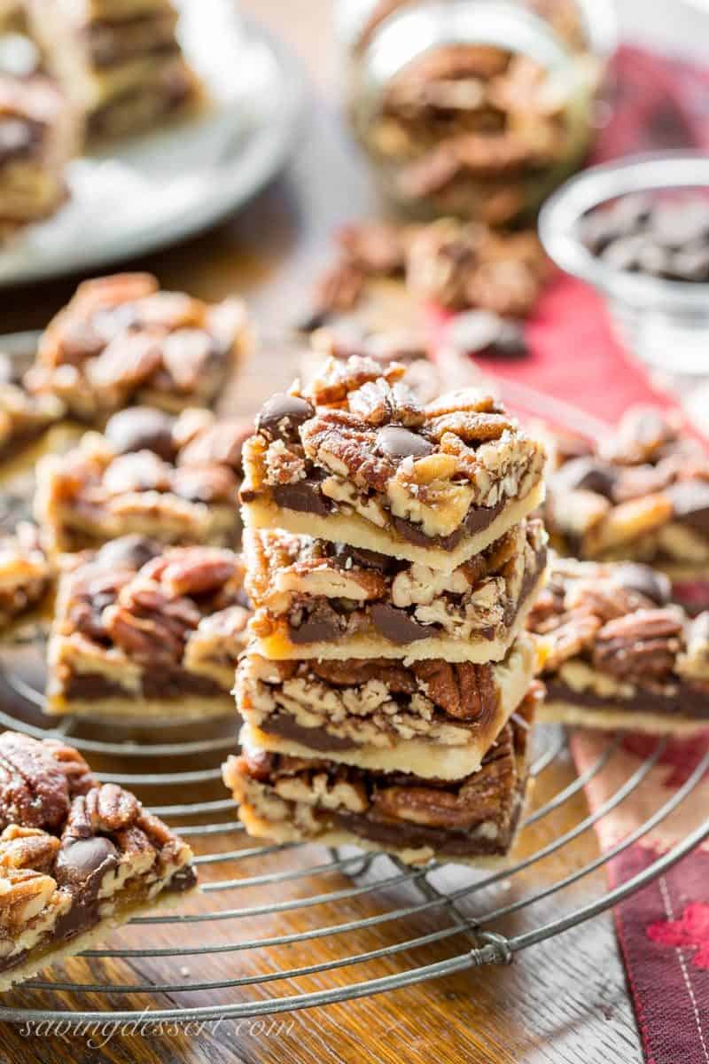 Chocolate Pecan Pie Bars with Bourbon & Sea Salt ~ a delicious and super nutty take on one of our favorite holiday pies! More toasty nuts and less filling than the pecan pies we all love, these bars are much easier to make too. www.savingdessert.com #savingroomfordessert #pecanpie #pecanpiebars #pecanbars #chocolatepecan #dessert #holidaybaking #piebars