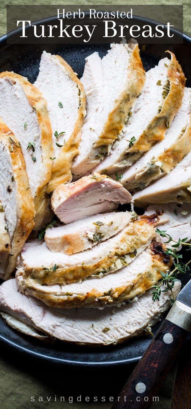 A platter of sliced turkey breast with fresh herbs