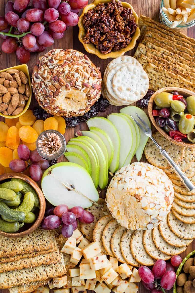 Mom's Party Cheeseball ~ every party needs an easy and delicious cheese ball made with cream cheese, mild and sharp cheddar cheese and a few spices. A make ahead appetizer that holds up wonderfully for hours and is great served with crackers, bread, fruit and nuts. www.savingdessert.com #cheeseball #appetizer #savingroomfordessert #partyappetizer