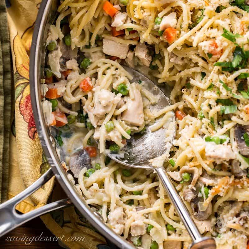 Turkey Tetrazzini Recipe - put your leftover turkey to work in this creamy, hearty casserole loaded with peas, carrots, Parmesan cheese and plenty of mushrooms. www.savingdessert.com #savingroomfordessert #turkey #tetrazzini #turkeycasserole #leftoverturkey #thanksgiving #turkeytetrazzini