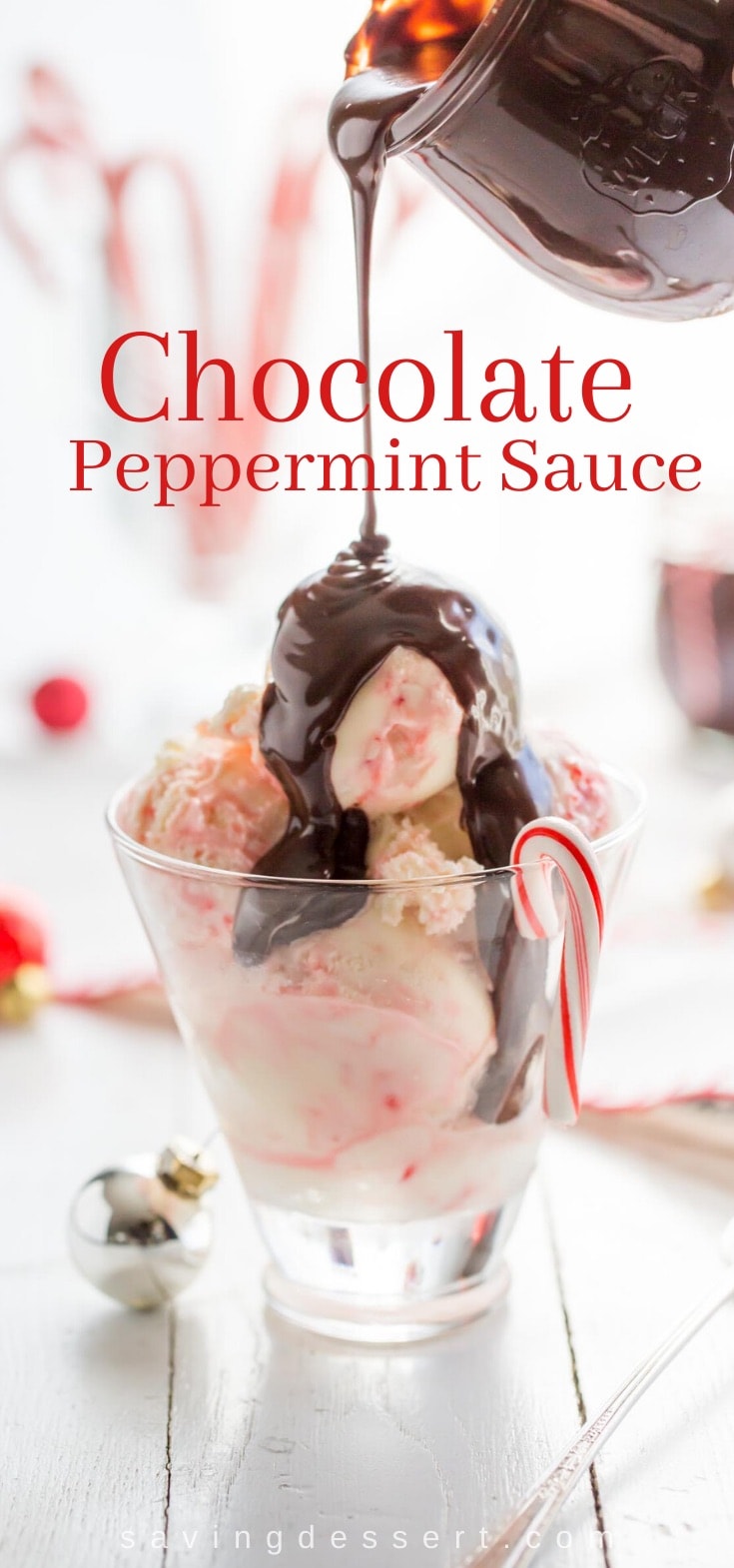 A jar of chocolate peppermint sauce poured over peppermint ice cream