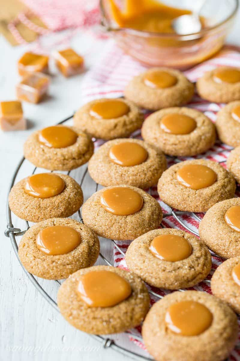 Ginger Molasses Thumbprint Cookies with Caramel ~ a terrific little molasses cookie with a crisp exterior, plenty of bite from the ginger, and a smooth, gooey milky caramel center.  www.savingdessert.com #savingroomfordessert #gingercookies #molassescookies #thumbprintcookies #thumbprint #christmascookies #cookies #caramelcookies