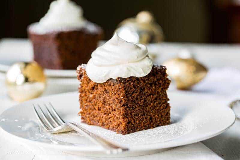 A piece of classic Gingerbread Cake topped with lemon whipped cream