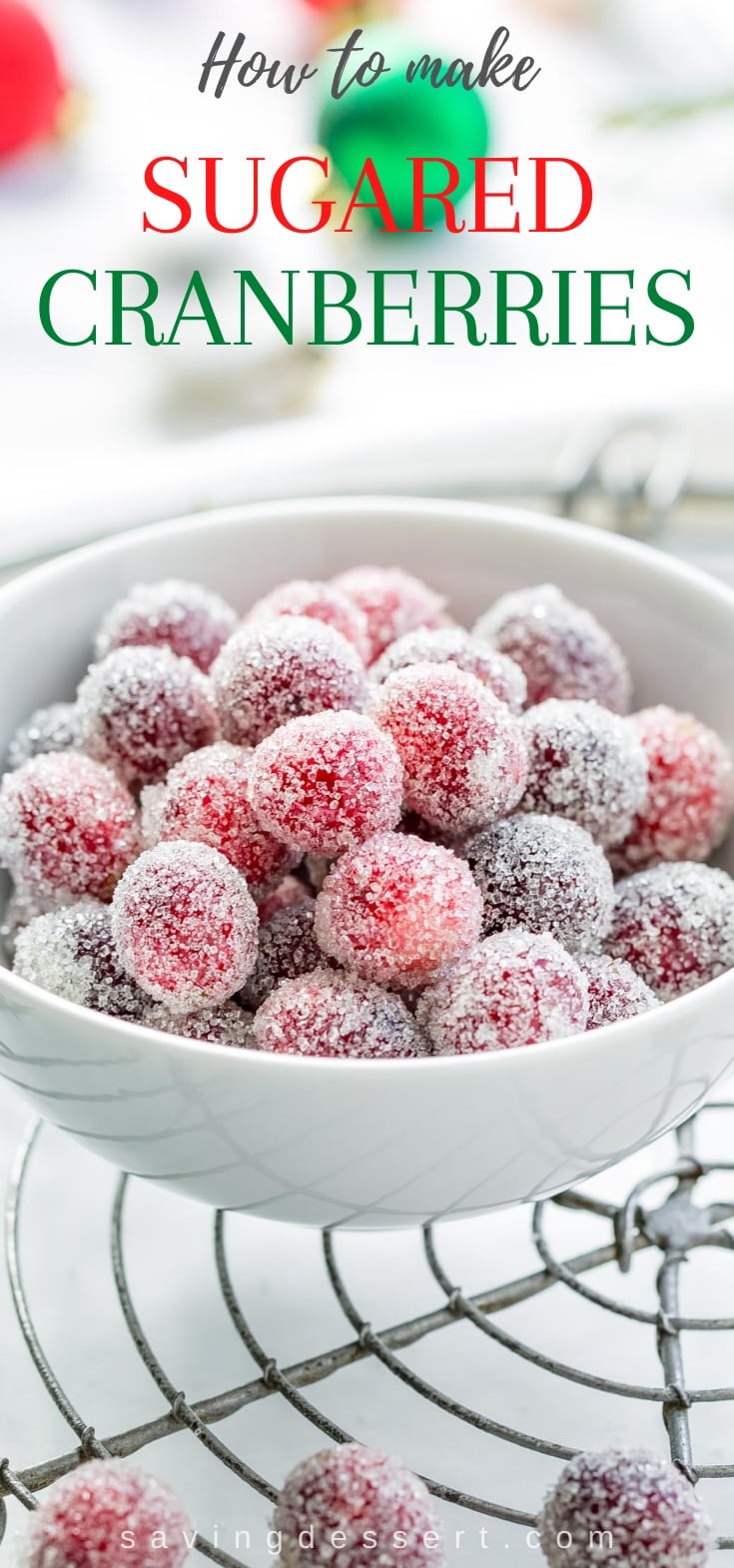 A bowl of sugared cranberries on a cooling rack