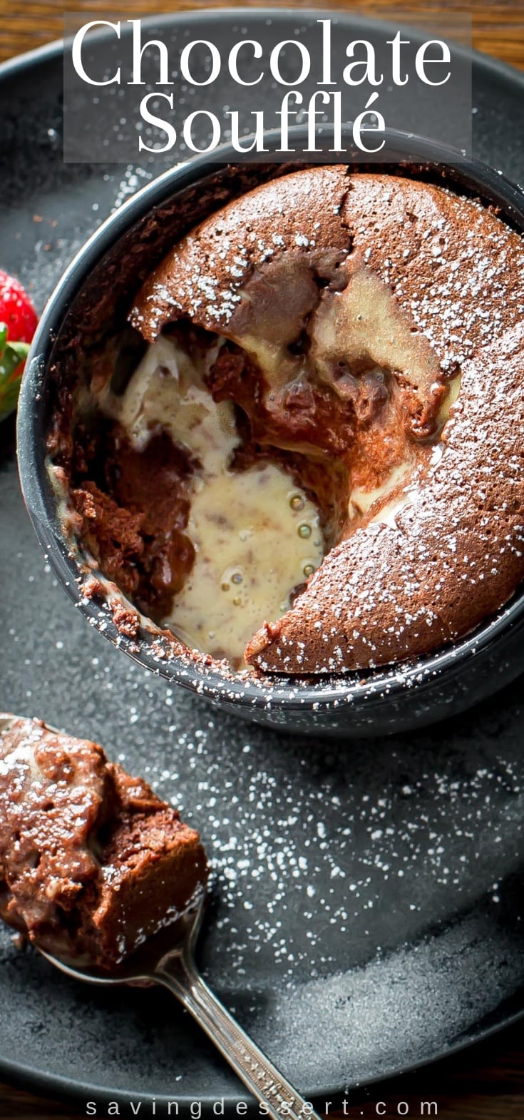 Overhead view of a chocolate soufflé with a creme anglaise sauce on top