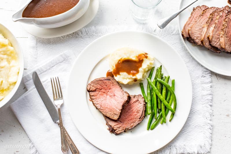 Classic Roast Beef and Gravy with mashed potatoes and green beans. www.savingdessert.com