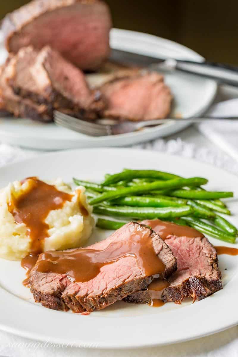 Classic Roast Beef and Gravy with mashed potatoes and green beans. www.savingdessert.com