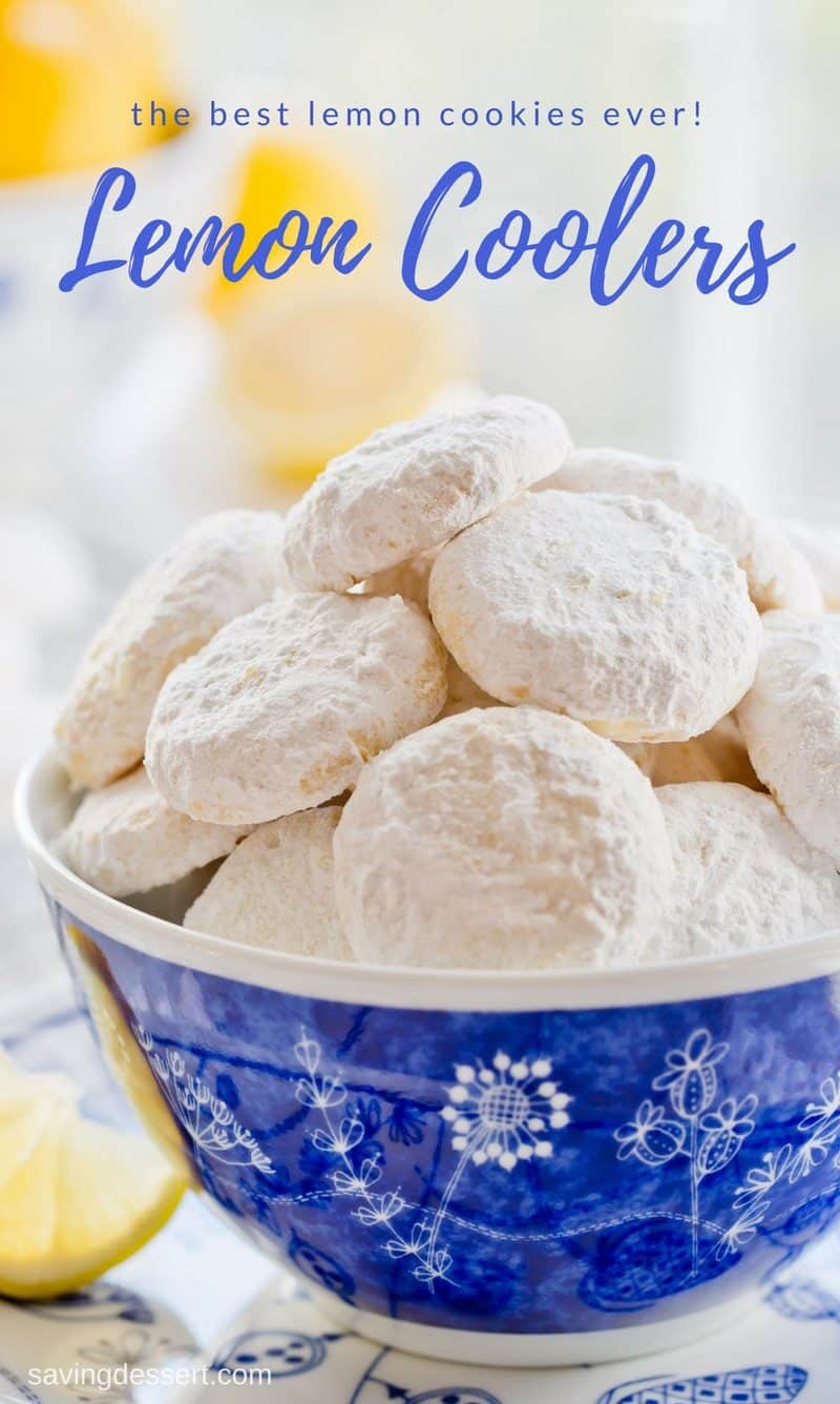 A bowl of powder sugar covered lemon cookies