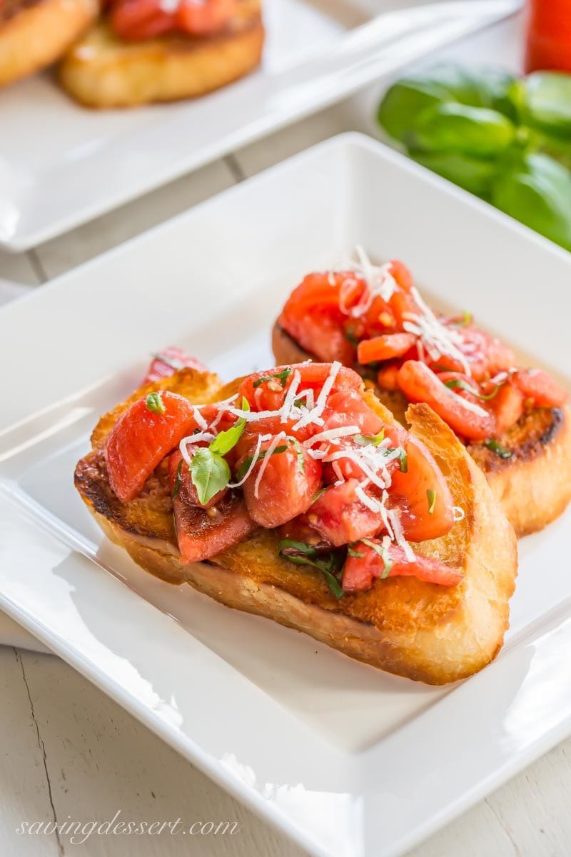 Tomatoes, basil, and Parmesan cheese on toasted Italian bread - Bruschetta!