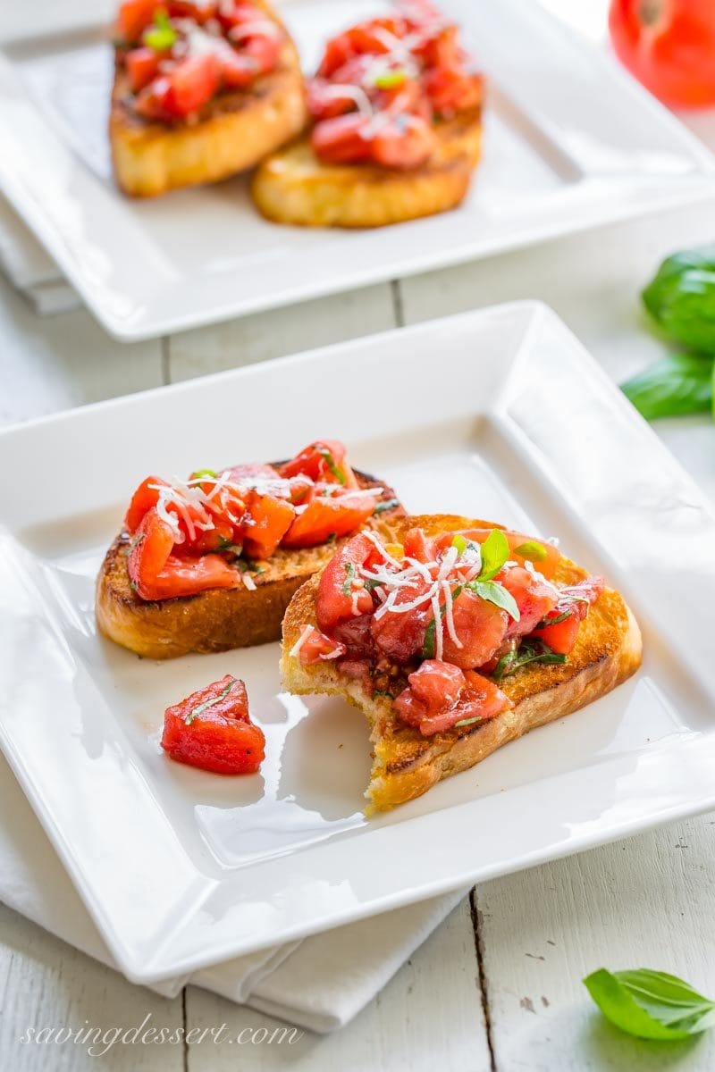 Tomatoes, basil, and Parmesan cheese on toasted Italian bread - Bruschetta!