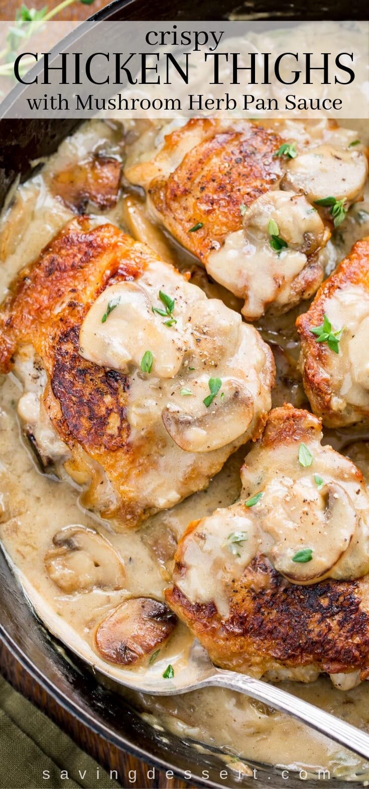 A skillet filled with crispy chicken thighs in a mushroom herb pan sauce