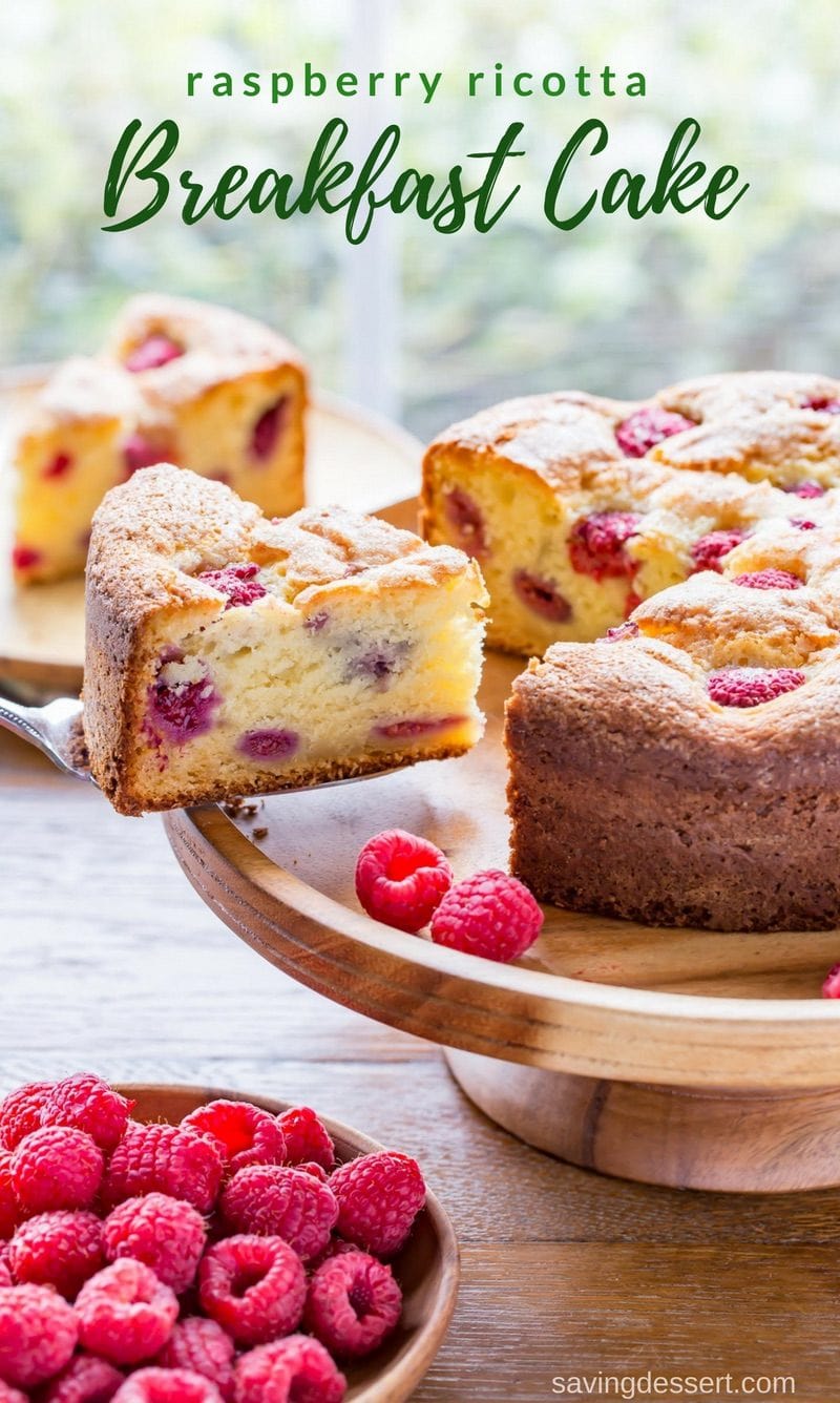 Sliced raspberry ricotta breakfast cake with fresh raspberries